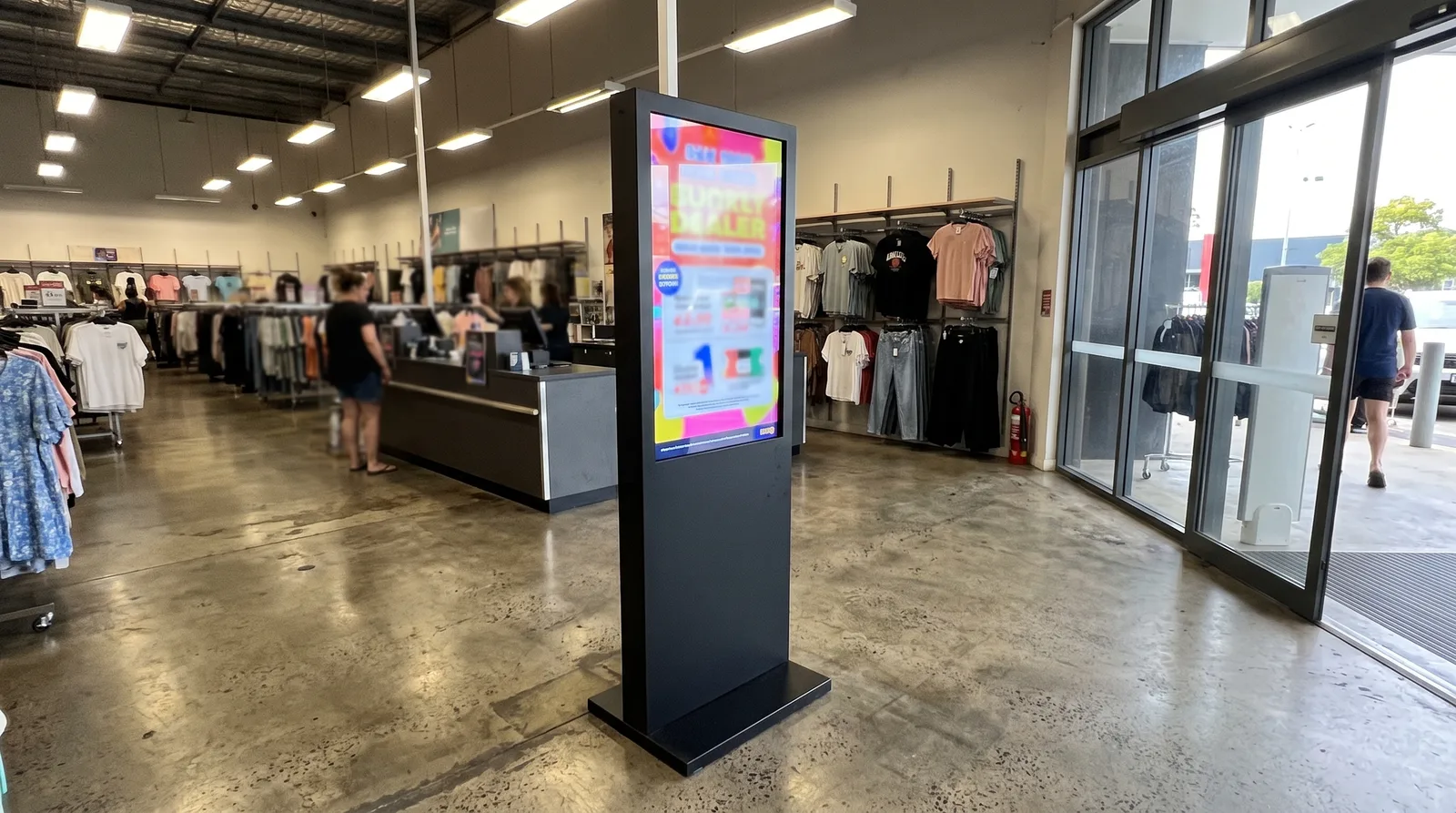 Freestanding LED poster totem in a retail store