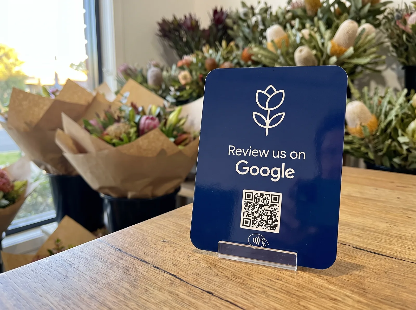 Custom printed navy review card with a business logo
